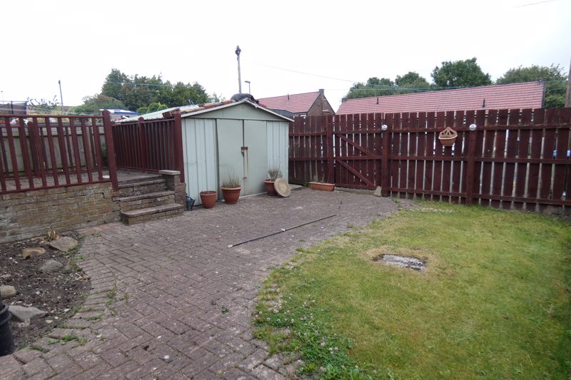 Rear paved garden- click for photo gallery